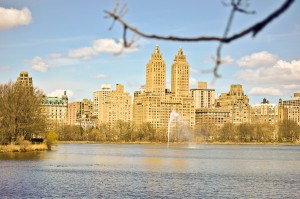 Central Park West rises behind the lake.
