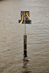 You have to give the graffiti artist credit for effort on this one.  It's in the middle of the river.