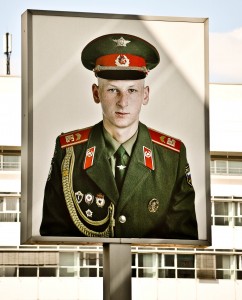 "And I'm the creepy,  homely,  jug-eared,  skinny commie welcoming you back to the land where your neighbors are probably spying on you for the Stasi."