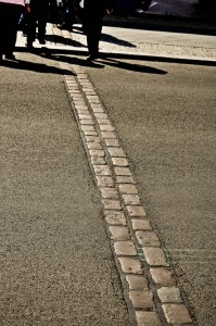 This double cobblestone line winds through the city,  marking the location of the former Wall.